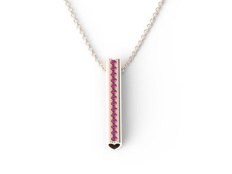 A rose gold necklace with pink tourmaline and a Heart pendant