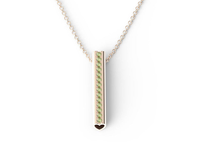 Peridot gemstones set down a rose gold Heart pendant on a rose gold chain