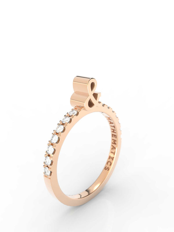 Top view of 14k yellow gold diamond pavé ampersand slice ring, featuring length and look of slice ring design, white diamonds