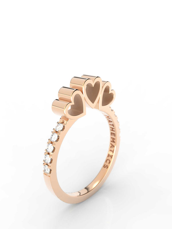 Top view of 14k yellow gold diamond pavé triple heart slice ring, featuring length and look of slice ring design and white diamonds